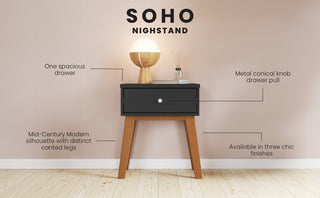 The Child Craft Soho Nightstand in Ebony is a mid-century modern piece with a spacious drawer, conical metal knob, and canted legs. Perfect for nursery use, it displays a lamp and decor on top against a light wall.