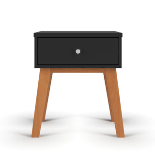 The Child Craft Soho Nightstand in Ebony features a sleek black drawer with a silver knob and four angled wooden legs, shown against a plain white background.