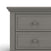 A close-up of the upper left corner of the Child Craft Jordyn Nightstand in Lunar Gray shows baby-safe finishes, classic lines, two drawers with round knobs, and subtle crown molding. Ready-to-assemble design.