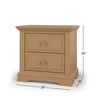 The Child Craft Jordyn Nightstand in Biscotti features crown molding and two drawers with round knobs. Ready-to-assemble, it measures 25"H x 26"W x 18"D—ideal for the nursery.