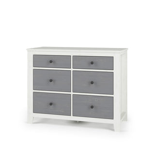 The Child Craft Ocean Grove Double Dresser, White/Gray, features six gray drawers, a white frame, round black knobs, and short legs—combining nautical farmhouse style with practical nursery storage in any room.