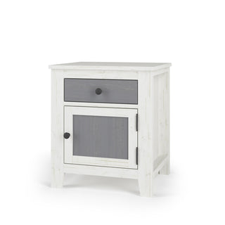 The Child Craft Ocean Grove Nightstand in White/Gray features a compact design with a gray drawer and cabinet door, each with round black knobs, set on four short legs—a stylish bedside table for any room.