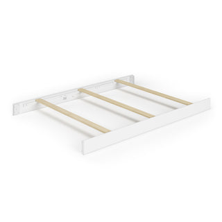 The Child Craft F06401 Full-Size Bed Rails in matte white are shown partially assembled, connecting a white headboard and footboard with three light pine rails, all set against a white background.
