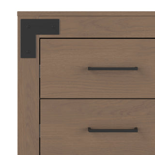 A close-up of the Child Craft Lucas Dresser in Dusty Heather, showing two drawers with black metal handles and a black metal corner bracket on the top left.