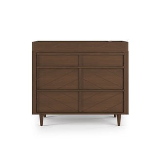 Turn your dark wood dresser with three drawers and geometric front into a modern nursery essential—just add the Child Craft F01792 Universal Dressing Kit in Toasted Chestnut for practical versatility and stylish, mid-century flair.
