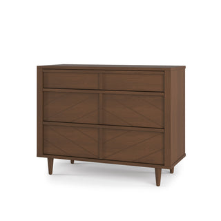The Child Craft Surrey Hill 3 Drawer Dresser in Toasted Chestnut features a mid-century modern design with tapered legs, subtle geometric patterns on the drawer fronts, and a warm medium brown finish.