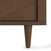 Close-up of the Surrey Hill 3 Drawer Dresser by Child Craft in Toasted Chestnut, showing its tapered legs and diagonal groove design against a white background.