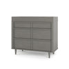 A modern gray Child Craft dresser with six drawers and angled legs is shown. Add the F01792 Universal Changing Table Topper in Lunar Gray by Child Craft to easily convert it into a convenient baby changing station.