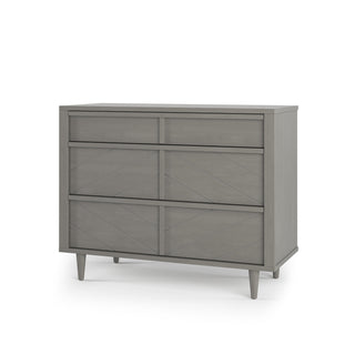 The Child Craft Surrey Hill 3 Drawer Dresser in Lunar Gray features a modern chevron pattern and tapered legs—blending style and function for your nursery.