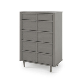 The Child Craft Surrey Hill 5 Drawer Chest in Lunar Gray features a tall, modern design with angled legs and geometric drawer fronts, shown on a white background. Clean lines and wooden construction complete its contemporary look.