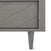 Close-up of the Child Craft Surrey Hill 5 Drawer Chest in Lunar Gray, featuring a gray finish, diagonal groove pattern on the door, and a single tapered leg visible at the bottom right.