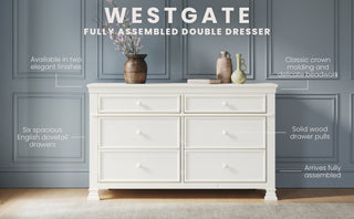 The Child Craft Westgate Double Dresser in Vintage Linen stands against a gray paneled wall, featuring crown molding, six drawers with solid pulls, and a fully assembled pine wood design—ideal for any nursery dresser setup.