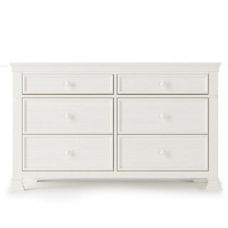 The Child Craft Westgate Double Dresser in Vintage Linen features six drawers with round knobs, a classic design, smooth finish, and decorative trim—ideal for timeless nursery style and storage.