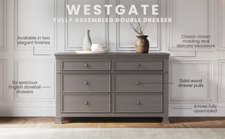 The Child Craft Westgate Double Dresser in Chelsea Gray features six spacious drawers, decorative and crown molding, solid wood pulls, and arrives fully assembled. Perfect for a nursery or kids' room.
