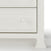 Close-up of the lower right corner of the Child Craft Westgate 5-Drawer Chest in Vintage Linen, featuring a round knob, two drawer fronts, and decorative square legs.