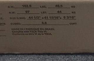 Close-up of a cardboard box label showing weights, dimensions, and product info—102.5 lbs, 97 lbs, 44 1/3 x 41 15/16 x 6 3/16, MADE IN BRAZIL—for the Child Craft Harmony 3-Drawer Dresser with Changing Table Topper in Brushed Cotton.
