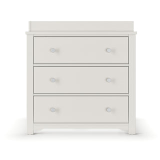 The Child Craft Harmony 3-Drawer Dresser with Changing Table Topper in Brushed Cotton features simple round knobs and a flat top, ideal for nursery storage or use with the topper, shown against a white background.