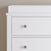 The Child Craft Harmony 3-Drawer Dresser with Changing Table Topper in matte white features clean lines and silver knobs, making it a stylish, practical nursery storage solution for any room.