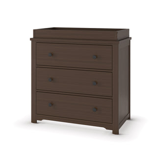The Child Craft Harmony 3-Drawer Dresser with Changing Table Topper in Brushed Truffle features three drawers with dual round black knobs and a raised edge on top, shown against a white background.
