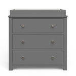 The Child Craft Harmony 3-Drawer Dresser with Changing Table Topper in Cool Gray features silver knobs and three drawers, making it ideal nursery furniture. It's shown set against a white background.