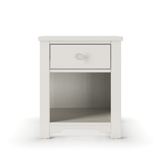 The Harmony Nightstand by Child Craft features a brushed cotton finish, single drawer with a round knob, lower open shelf, and modern clean-line design for a sleek, simple look.