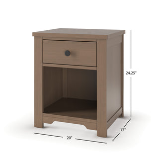 The Child Craft Harmony Nightstand in Dusty Heather offers practical bedside storage with a light brown finish, one drawer featuring a round black knob, an open shelf, child-safe finishes, and measures 24.25"H x 20"W x 17"D.