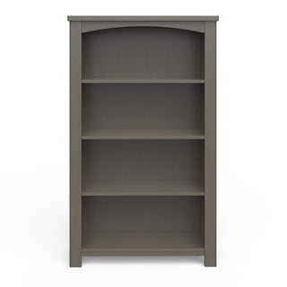 The Child Craft Harmony 4-Shelf Bookcase in Dapper Gray features a slightly arched top and four empty shelves. Made of wood, it stands alone on a white background.