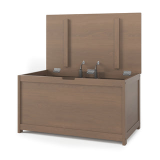 The Child Craft Harmony 33" Kids Toy Box in Dusty Heather features a natural wood finish, open lid with metal hinges, visible interior hardware, and a simple, modern design.