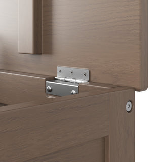 Close-up of a metal hinge with visible screws connecting two light brown wooden pieces, part of the Child Craft Harmony 33" Kids Toy Box in Dusty Heather.