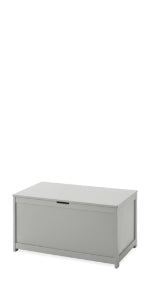 The Child Craft Harmony 33" Kids Toy Box in Cool Gray features a rectangular design with a hinged lid, front cutout handle, and short legs, shown against a white background.