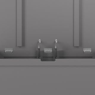 Close-up view of the Child Craft Harmony 33" Kids Toy Box in Cool Gray, highlighting its metal mounting bracket system with bolts, hinges, and support structures for secure assembly on a flat surface.