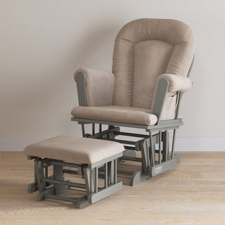 The Child Craft Tranquil Nursery Glider Cushion and matching ottoman, with gray wooden frames and visible gliding mechanisms, create a cozy baby rocking chair set for your nursery’s light wood floor and off-white wall.