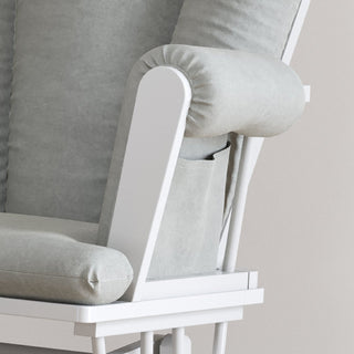 Close-up of the Child Craft Tranquil Nursery Glider and Ottoman in Matte White, showcasing its minimalist, contemporary design with light grey cushions and a built-in side pocket on the armrest.