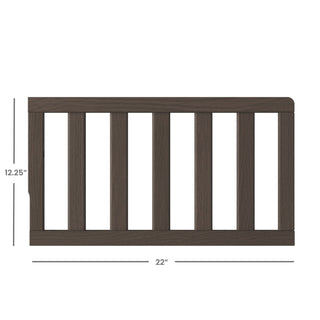 The Child Craft F09501 Toddler Guard Rail in Dapper Gray features strong wood construction and vertical slats, measuring 12.25" tall by 22" wide—ideal for use as a crib toddler guard rail.