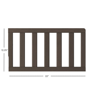 The Child Craft F09501 Toddler Guard Rail in Dapper Gray features strong wood construction and vertical slats, measuring 12.25" tall by 22" wide—ideal for use as a crib toddler guard rail.