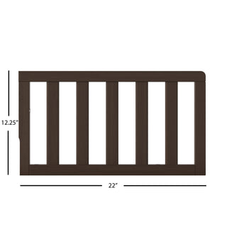 The Child Craft F09501 Toddler Guard Rail in Brushed Truffle features vertical slats and measures 12.25" high by 22" wide. Perfect for crib conversion or pairing with Child Craft cribs; displayed on a white background with measurement lines.
