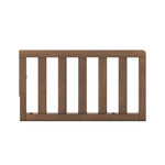 The Child Craft F09501 Toddler Guard Rail in Cocoa Bean features five vertical slats with a solid top and bottom frame, designed for easy crib conversion, shown against a white background.