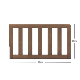 The Child Craft F09501 - Toddler Guard Rail in Cocoa Bean features a wooden panel with vertical slats, measuring 56 cm wide by 31 cm tall, shown against a white background with labeled measurements. Perfect for crib conversion.