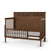The Child Craft F09502 Toddler Guard Rail in Cocoa Bean is a wooden bed with three closed slatted sides, one open side with a guard rail, and a low white mattress—ideal for an easy transition from a Child Craft crib.