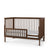 The Child Craft F09502 Toddler Guard Rail in Cocoa Bean features open slatted sides, a dark brown finish, low profile, partial guard rail on one side, and is displayed with a white mattress against a white background.