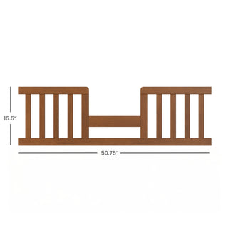 The Child Craft F09514 Toddler Guard Rail in Coach Cherry features vertical slats, a center panel, and sturdy wood construction; perfect for crib-to-toddler bed setups. Dimensions: 15.5" tall x 50.75" wide.