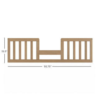 The Child Craft F09514 Toddler Guard Rail in Nutmeg features vertical slats on each side, a center gap, and measures 15.5"H x 50.75"W, ideal for crib conversion; shown against a white background.