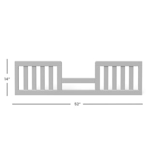 The Child Craft Toddler Guard Rail - Gentle Gray features vertical slats, measures 14"H x 52"W, and has a lower center with higher sides for safety. Designed for crib conversion, it's compatible with Child Craft cribs.