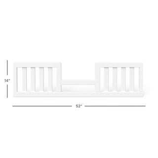 The Child Craft F09544 Toddler Guard Rail in matte white features vertical slats, measures 14" high by 52" wide, and uses non-toxic baby-safe finishes. Designed to attach to the side of a bed to help prevent toddler falls.