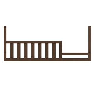 The Child Craft F09554 Toddler Guard Rail in Toasted Chestnut features vertical slats on the left and an open section on the right, designed to attach securely to a Child Craft crib for safe toddler bed conversion.