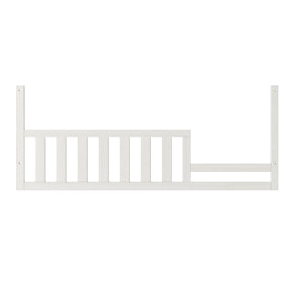 The Child Craft F09554 Toddler Guard Rail in Vintage Linen features vertical slats and end mounting holes for easy crib-to-toddler bed conversion, offering added safety and compatibility with Child Craft crib models.