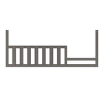 The Child Craft F09554 Toddler Guard Rail in Chelsea Grey features vertical slats and mounting holes for secure attachment to any Child Craft crib, offering added safety as a toddler bed conversion or crib guard rail.