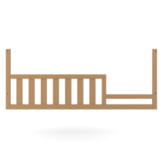 The Child Craft F09554 Toddler Guard Rail in Biscotti, featuring vertical slats, two horizontal support bars, and mounting holes on each end, is shown against a white background—perfect for toddler bed conversion.