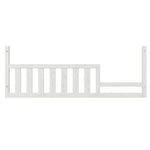 The Child Craft Toddler Guard Rail in White/Brown features vertical slats and an uneven top edge, easily attaching to a toddler bed or crib conversion to add extra safety for your child.