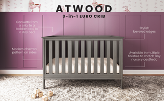 The Child Craft Atwood 3-in-1 Euro Convertible Crib in Lunar Gray features chevron-patterned sides and beveled edges, set in a nursery with purple paneled walls, animal wallpaper, and wooden blocks scattered on the floor.